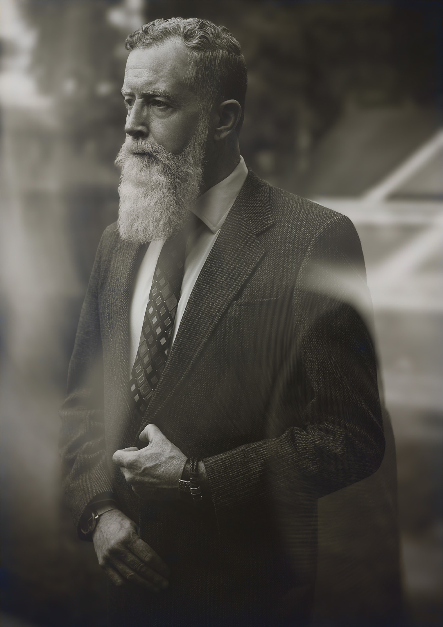 Mr. Millin: a black-and-white portrait of a bearded man in a suit